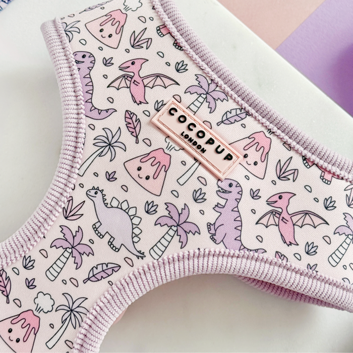 Pink Cocopup London harness with adjustable neck, featuring cartoon dinosaurs, palm trees, and volcanoes.