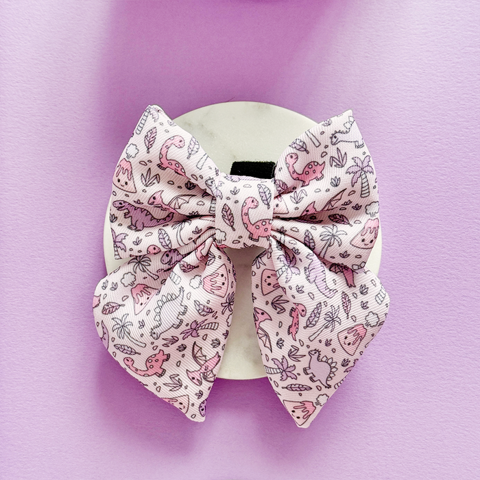 Cocopup London Princess Dino Sailor Bow Tie featuring playful dinosaur and plant patterns on a fabric dog accessory.