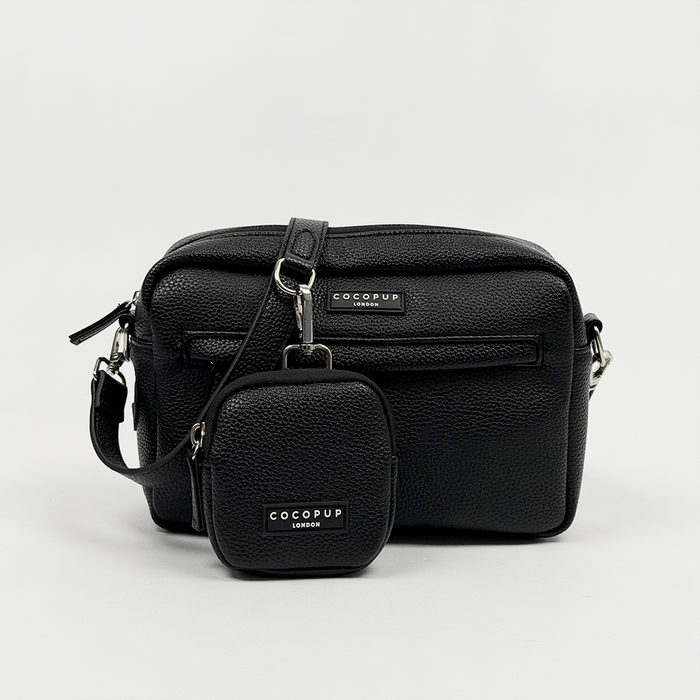 Black PU leather dog walking bag with silver hardware and matching poop bag dispenser attached to the strap.