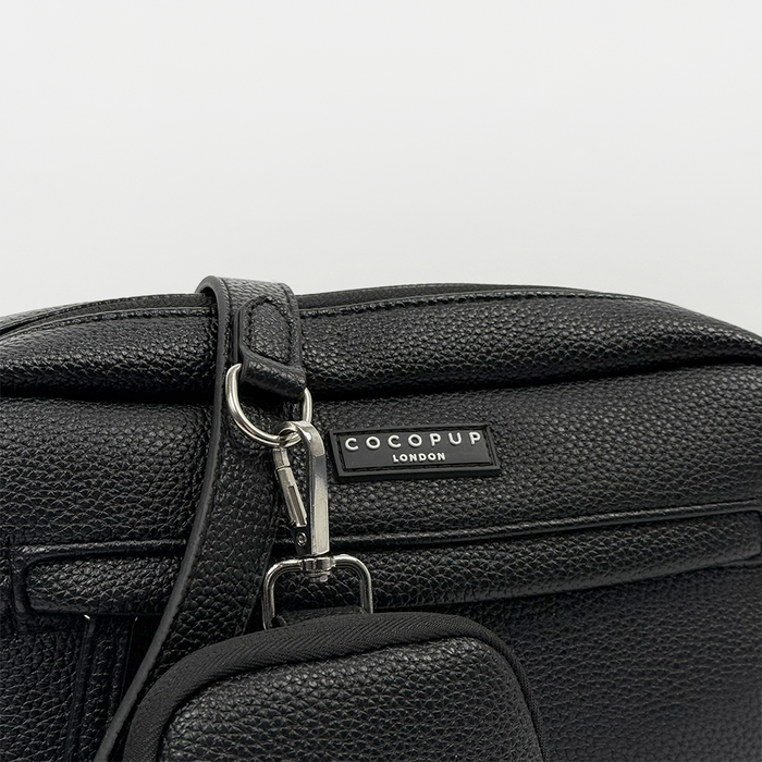 Black PU leather dog walking bag bundle with a front label and attached small pouch, shown in close-up.