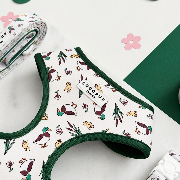 Duck print harness with green trim and matching leash from Cocopup London displayed side by side.