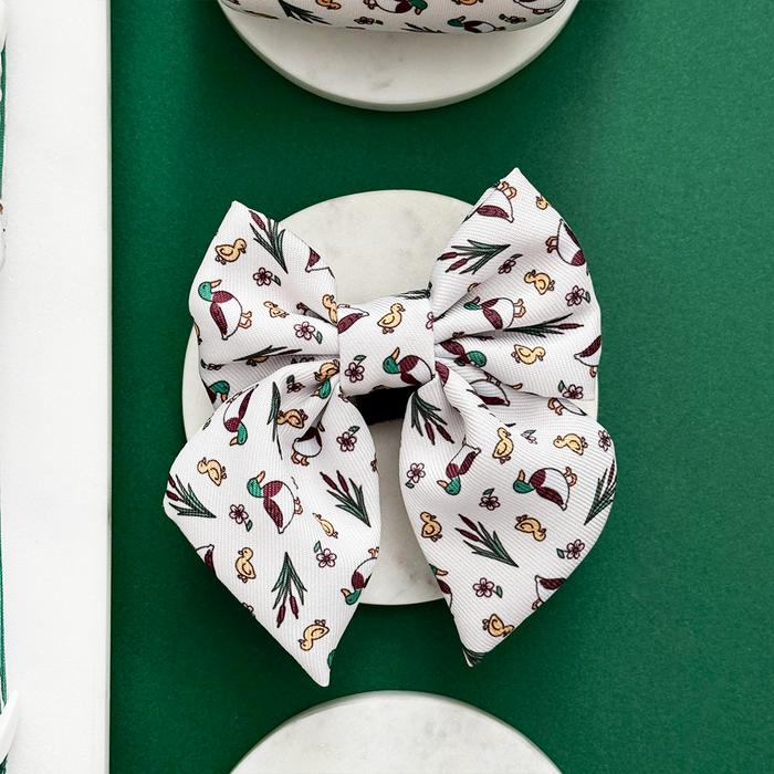 Red and green Christmas-patterned dog bow tie with a sailor style from Cocopup London.