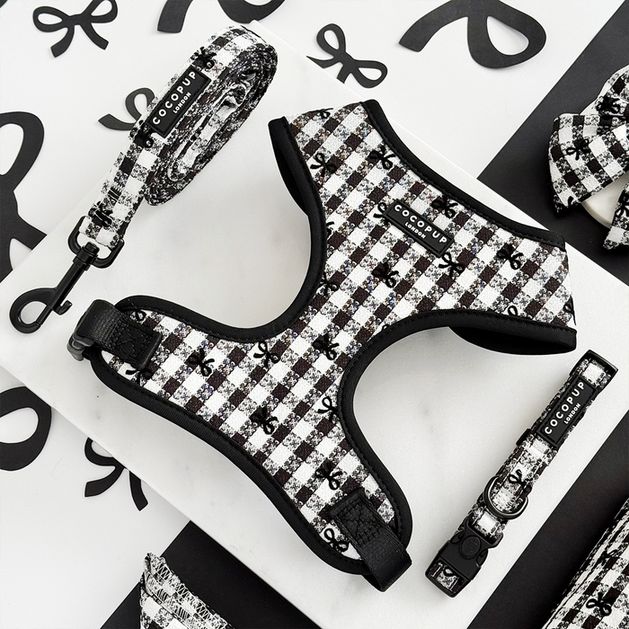 Black and white check Cocopup London harness, lead, and collar set displayed on a white surface.