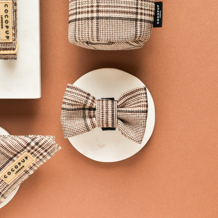Plaid bow tie and matching accessories on tan background with marble disc, by Cocopup London.