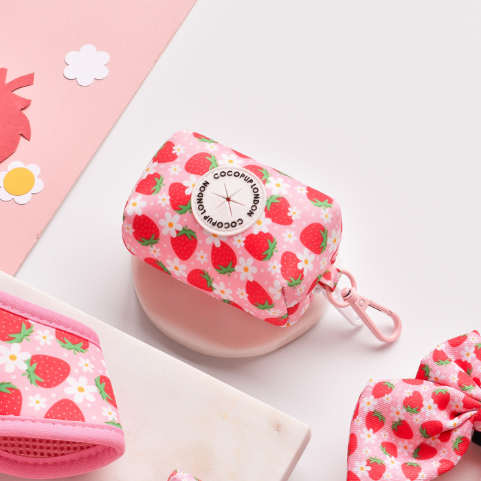 Neoprene poop bag holder with Pupberry Fields pattern and a metal carabiner clip, by Cocopup London.
