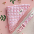 Quilted pink bandana with green ditsy floral pattern and matching leash, displayed on a pink background.
