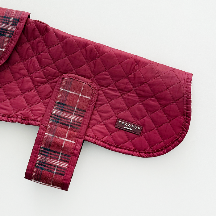 Quilted dog coat in mulberry plaid pattern with a soft, padded finish from Cocopup London.