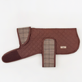 Quilted dog coat in plaid with soft teddy lining and Velcro straps, displayed on a white background.