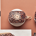 Quilted leopard print poop bag holder with gold zipper, metal clip, and Cocopup London logo.