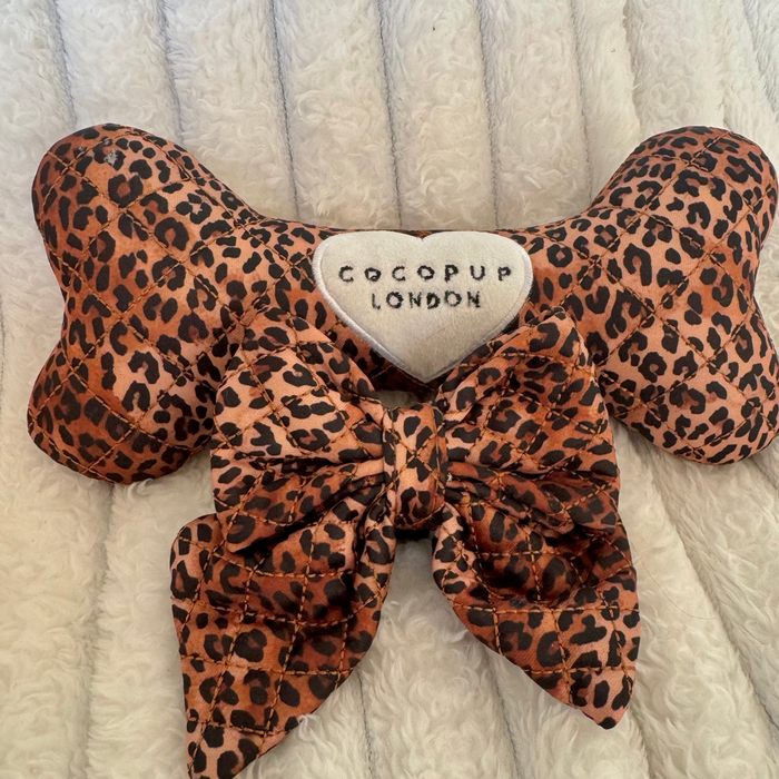 Leopard print dog bone toy and quilted sailor bow tie, both with Cocopup London heart patch.