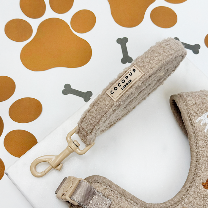 Mocha brown adjustable harness, lead, and collar set with paw and bone pattern from Cocopup London.