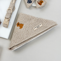 Mocha teddy-patterned bandana by Cocopup London displayed next to matching brown dog accessories.