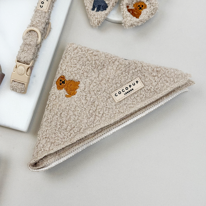Mocha teddy-patterned bandana by Cocopup London displayed next to matching brown dog accessories.