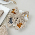 Beige dog sailor bow tie with mocha teddy fabric and small embroidered dog designs.