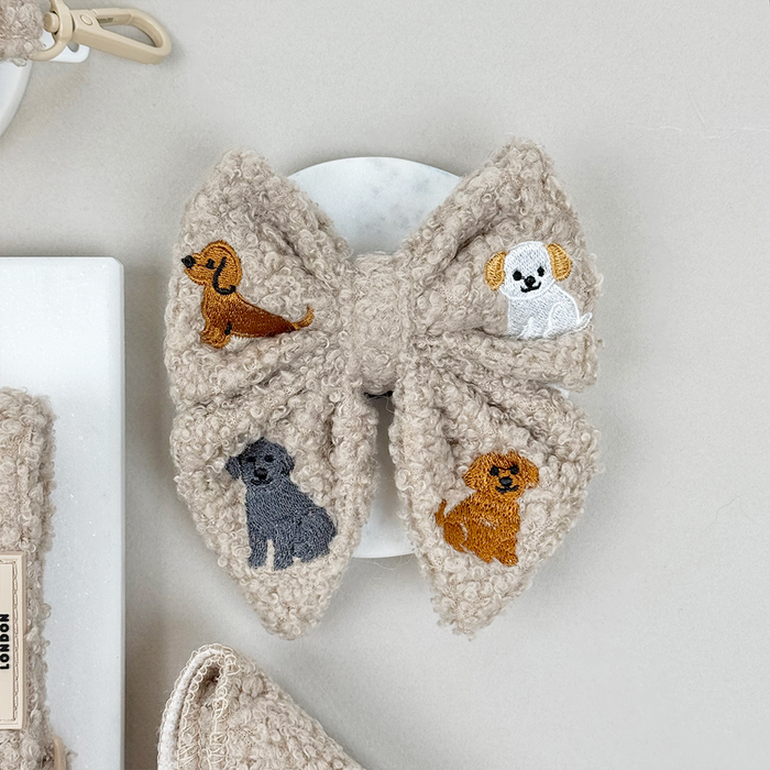 Mocha brown teddy sailor bow tie with embroidered dachshund, poodle, lab, and golden retriever dogs.