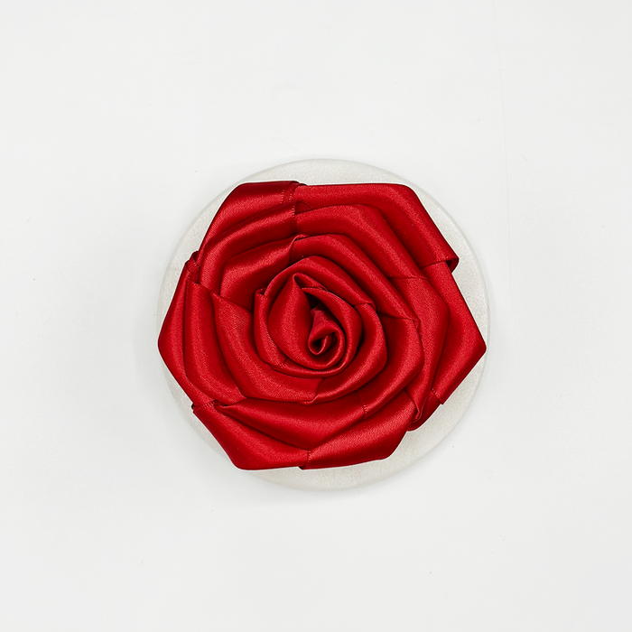 Cocopup London Red Rose Collar Flower displayed on a round white base with a plain white background.