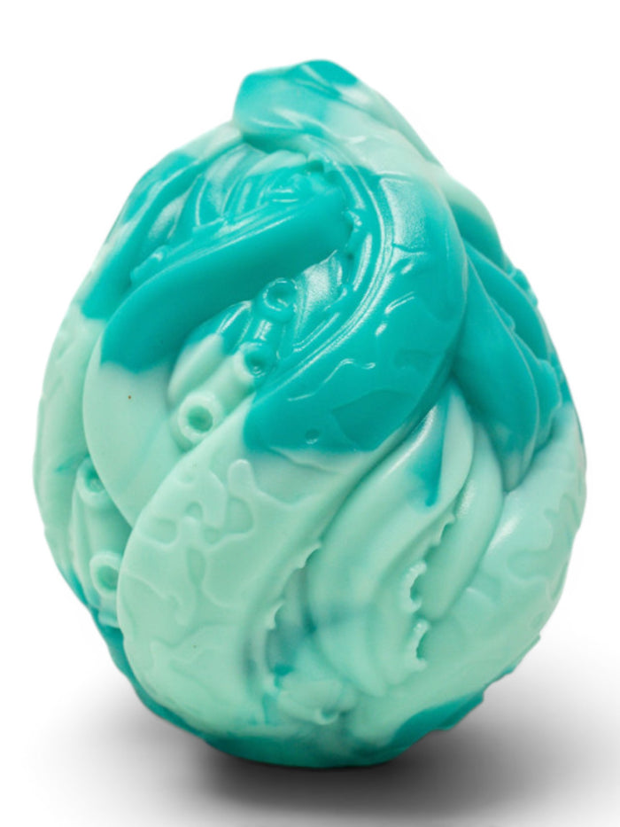 P.C Manufacturing Ltd Reef Egg, a teal and light blue marbled silicone egg toy with tentacle-like textures and ridges.