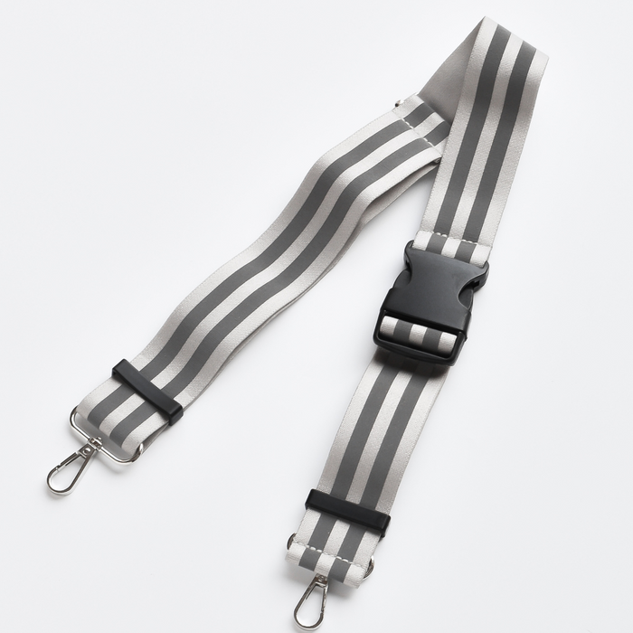 Nude Cocopup London reflective bum bag strap with black buckle and silver metal clasps.