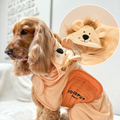 Soft beige dog drying robe by Cocopup London with a hood featuring plush lion ears.