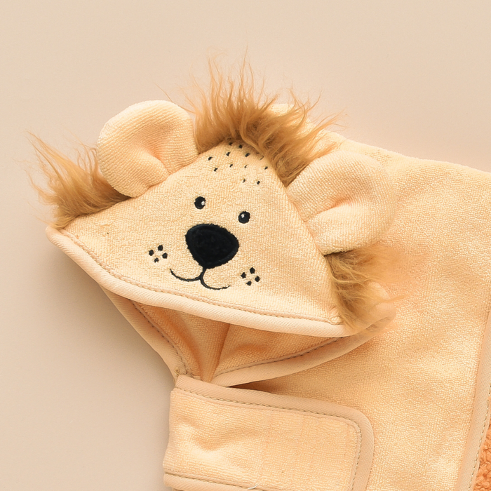 Beige microfiber kids’ hooded towel with lion face, ears, and mane from Cocopup London.