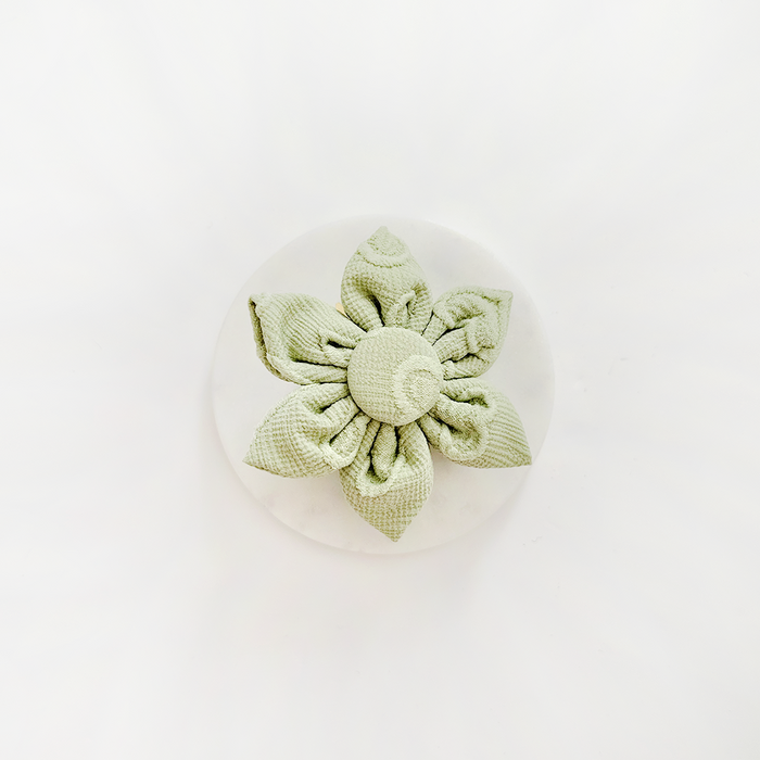 Sage green heart-shaped collar flower accessory with a soft, plush finish, designed for pet collars by Cocopup London.
