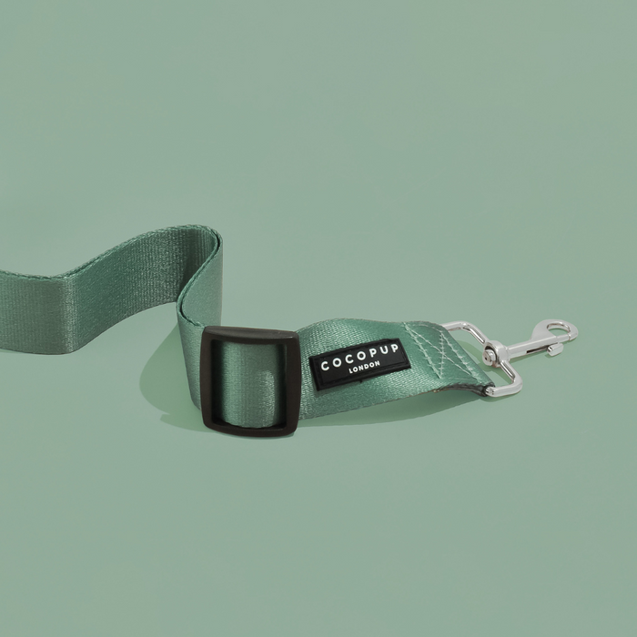 Khaki Cocopup London seat belt restraint for dogs with metal clasp and adjustable polyester strap.
