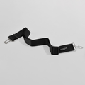 Plain black adjustable pet seat belt restraint with metal clasp from Cocopup London.