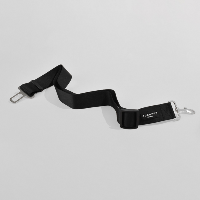 Plain black adjustable pet seat belt restraint with metal clasp from Cocopup London.
