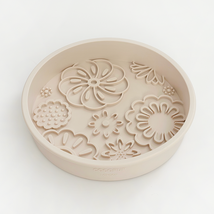 Baby pink floral Cocopup London slow feeder lick dog bowl viewed from above on a white background.