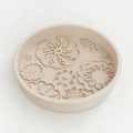 Baby pink floral Cocopup London slow feeder lick dog bowl viewed from above on a white background.