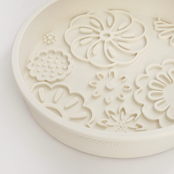 Cream slow feeder dog bowl with flower pattern from Cocopup London.