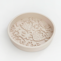 Beige slow feeder dog bowl with raised strawberry and flower shapes, Cocopup London Pupberry Fields design.