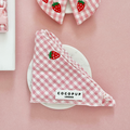 Pink dog bandana with a strawberry pattern from Cocopup London.