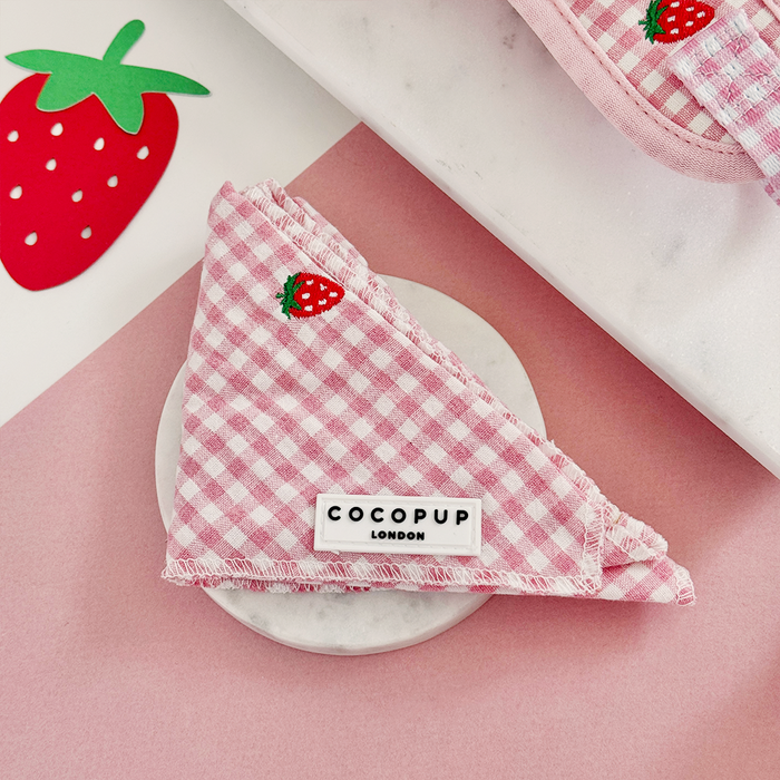 Pink gingham dog bandana with embroidered strawberries, by Cocopup London.
