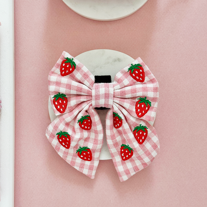 Pink gingham sailor bow tie with red strawberry embroidery by Cocopup London.