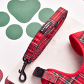Tartan-patterned Cocopup London dog leash and harness set with padded handle on a white background with green paw prints.