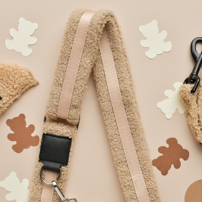 Beige fuzzy dog walking bag bundle with metal clips and bear-shaped cutouts on the strap by Cocopup London.