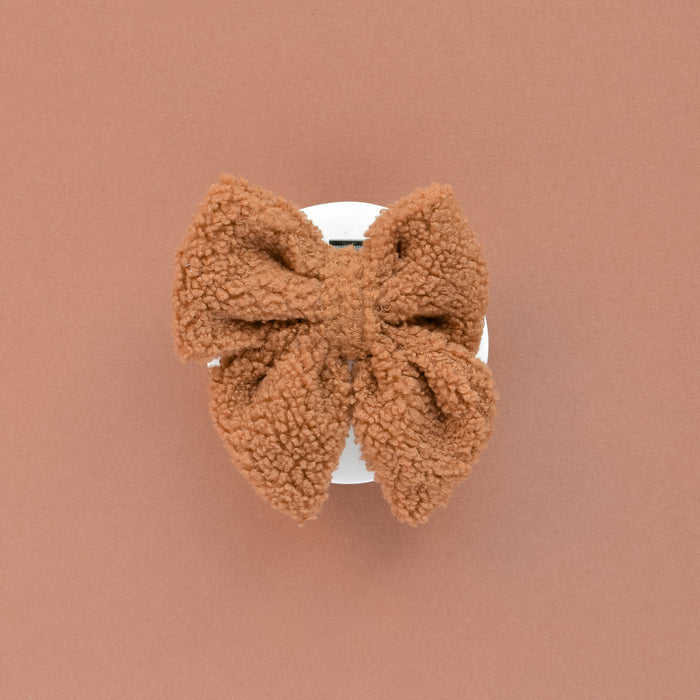 Teddy Sailor Bow Tie - Paddington by Cocopup London attached to a white claw clip on a terracotta background.