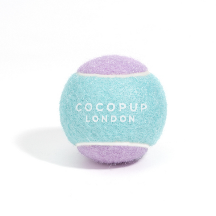 Cocopup London Bubblegum tennis ball with aqua blue and lavender panels on a white background.