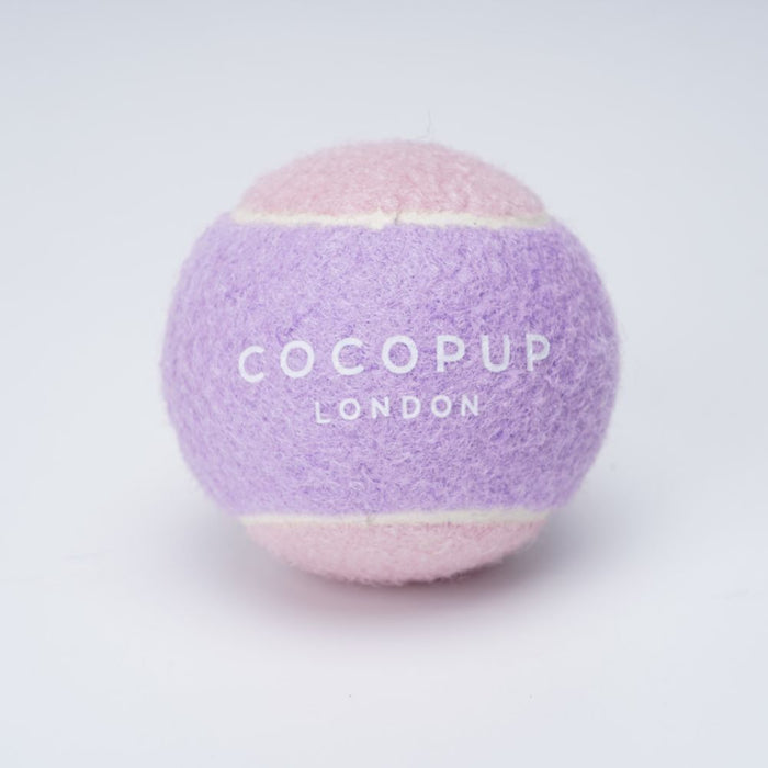 Pink and lilac Cocopup London tennis ball dog toy on a white background.