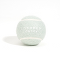 Light green Cocopup London tennis ball with brand logo, shown on a plain white background.
