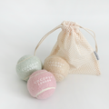 Set of three pastel tennis balls in Salted Caramel, Pistachio, and Strawberry colours from Cocopup London.