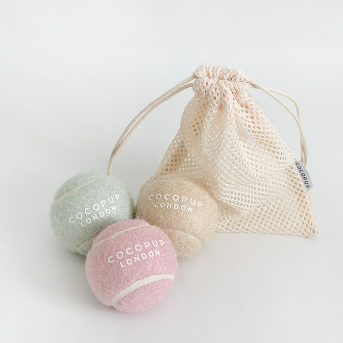 Set of three pastel tennis balls in Salted Caramel, Pistachio, and Strawberry colours from Cocopup London.