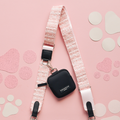 Pink textured tweed bag strap with paw print confetti pattern, designed for Cocopup London bags.