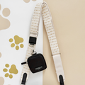 Vanilla textured tweed bag strap with small black pouch, Cocopup London branding visible on accessory.