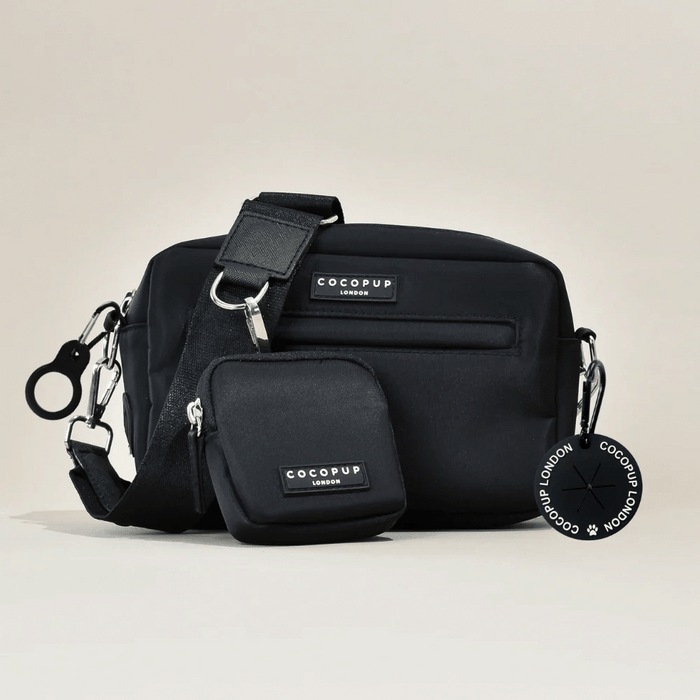 Black Cocopup London dog walking bag set with treat pouch, logo patch, and a round keychain.