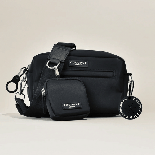 Black Cocopup London dog walking bag set with treat pouch, logo patch, and a round keychain.