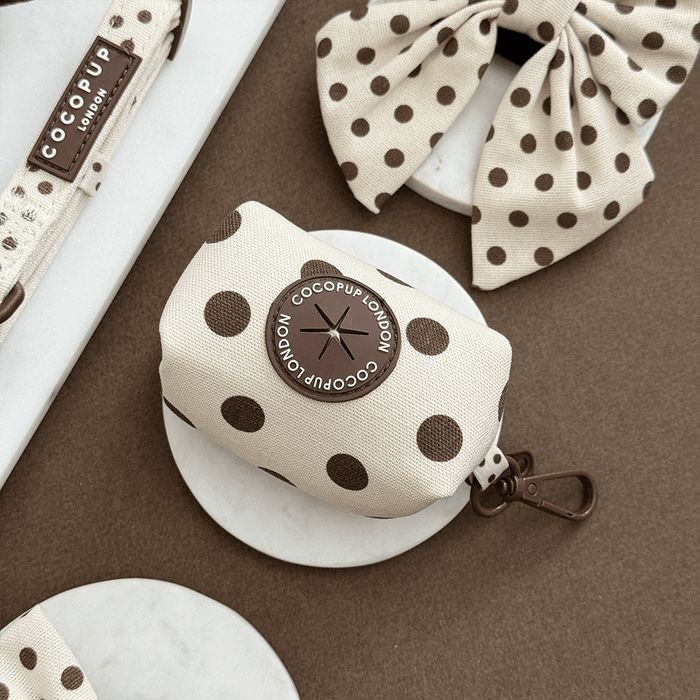 Polka dot product with COCOPUP London branding on a brown surface