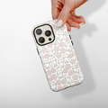 Cocopup London Tough Phone Case with a pattern of cute cats and pink flowers, held in a hand.
