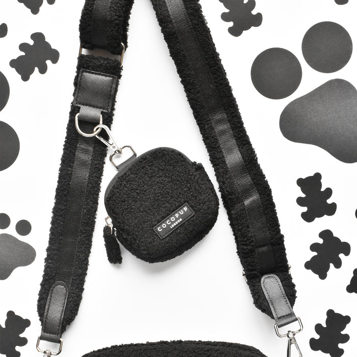 Cocopup London Teddy Baloo treat pouch in soft brown with paw and bone pattern, attached strap, on white background.